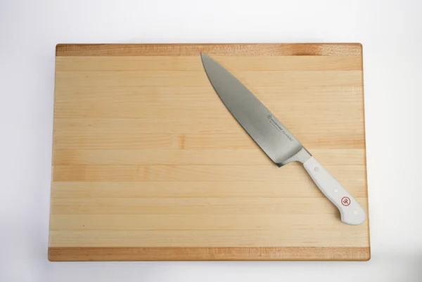 large maple cutting board overview with knife